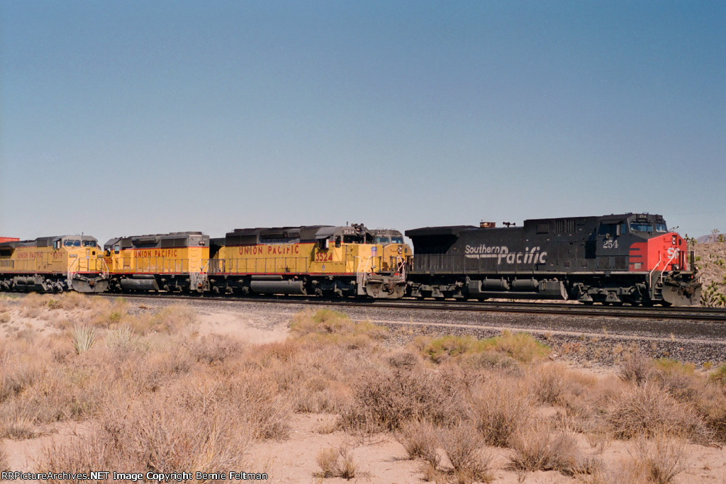 Southern Pacific AC44CW #254 is stopped next to two other sets of power